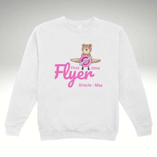 White sweatshirt with a bear graphic 'First time Flyer' and text on a gray background